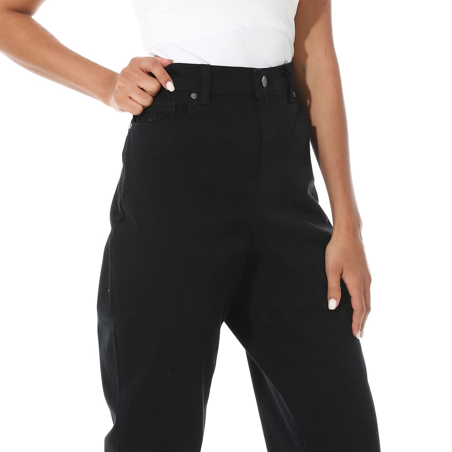 Black pants worn by a person on a white background