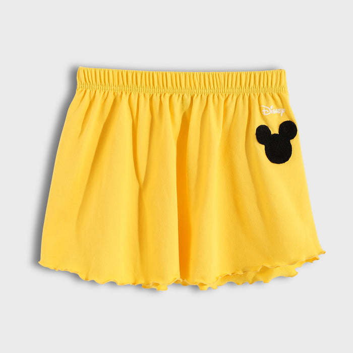 Yellow shorts with a black mouse ear design on a light gray background