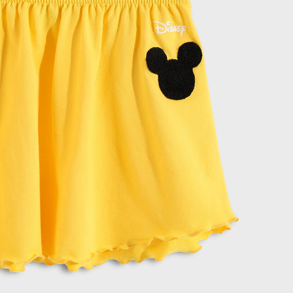 Yellow skirt with a black Mickey Mouse head design on a light gray background