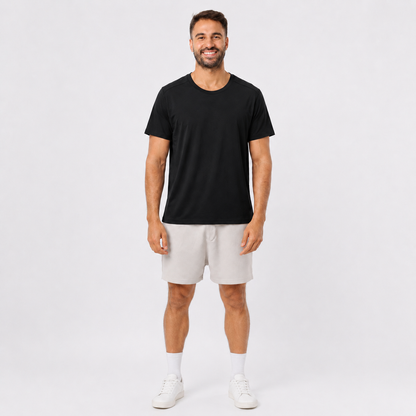 Man wearing a BLACK plain polyester short-sleeve T-shirt, front view