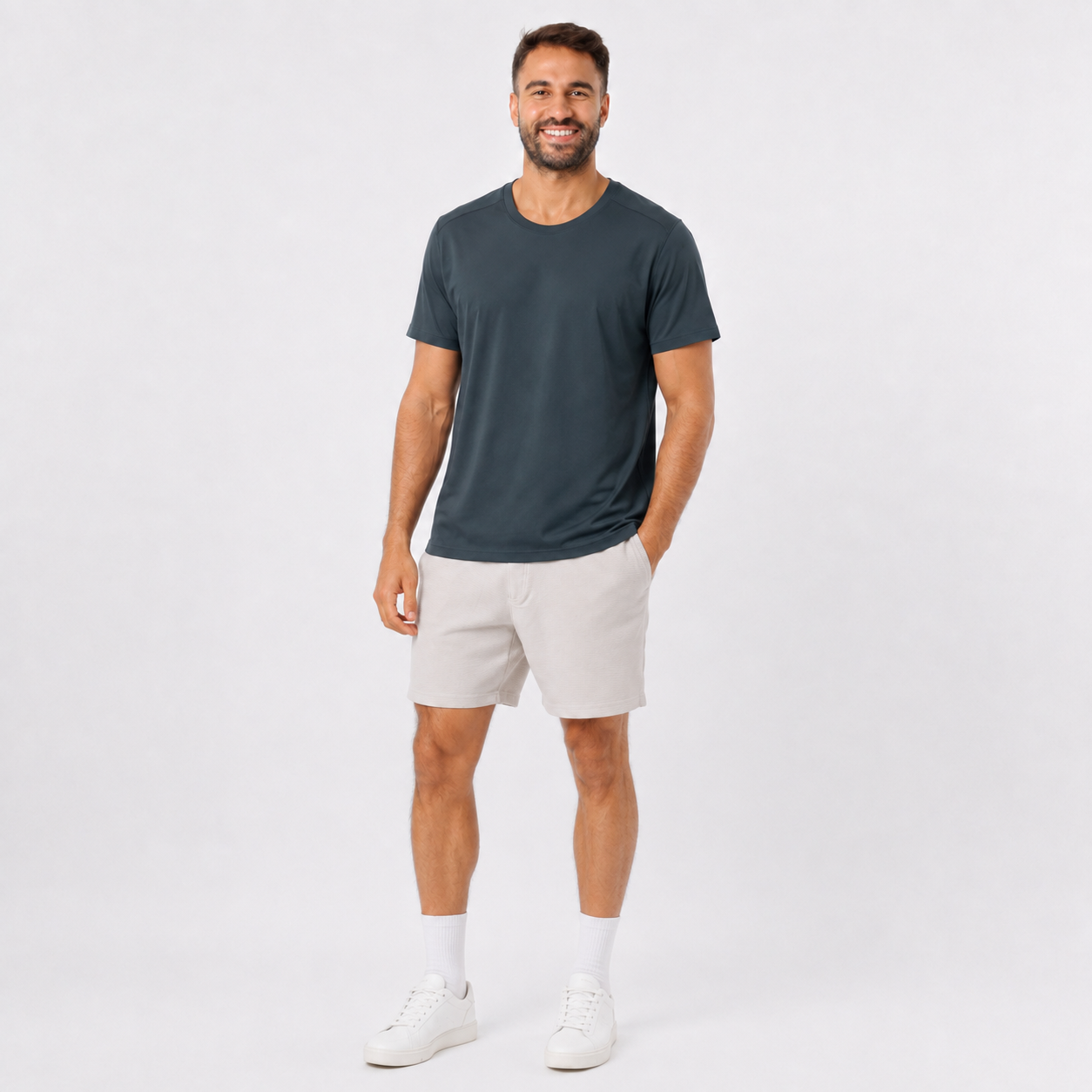 Man wearing a DARKGRAY plain polyester short-sleeve T-shirt, angled view