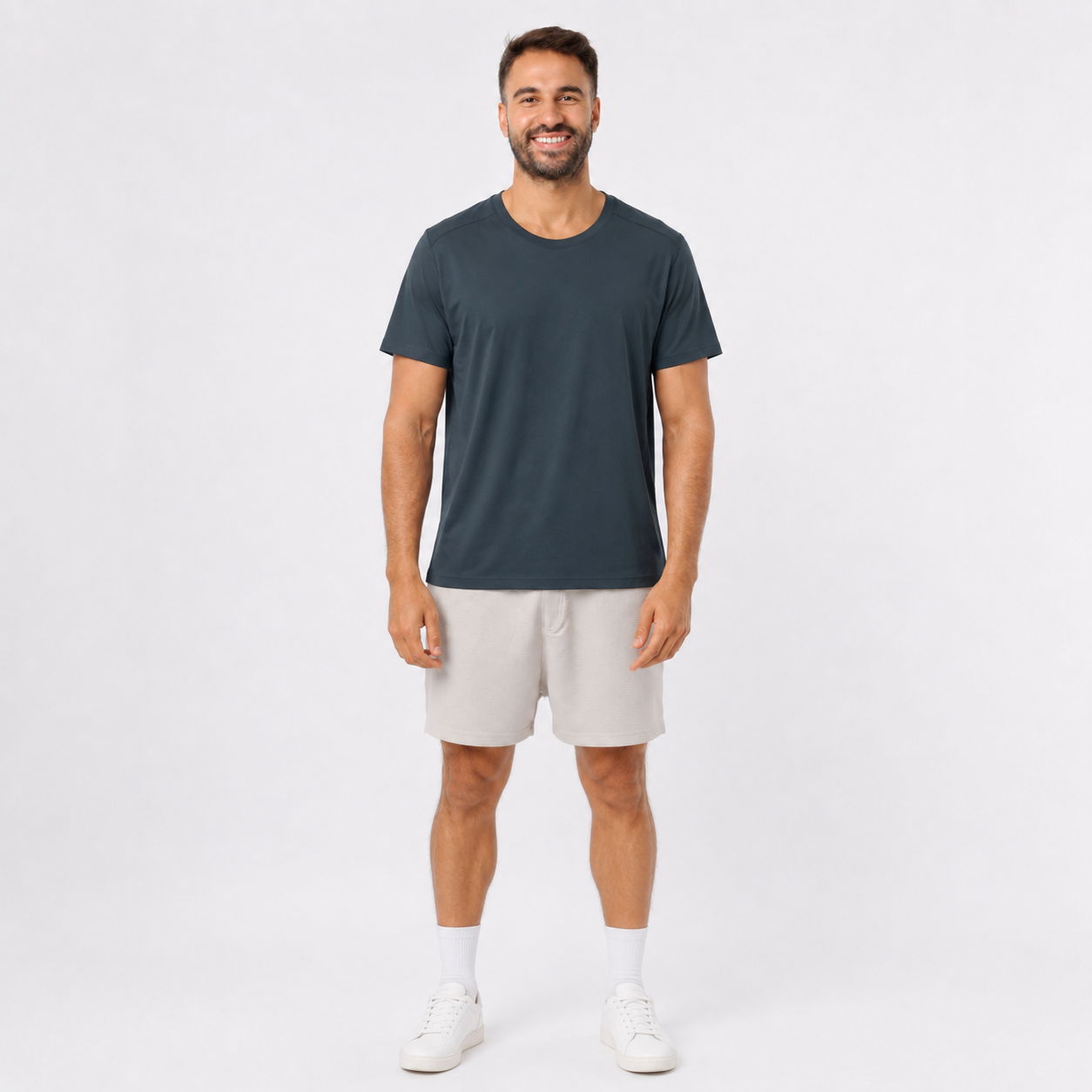 Man wearing a DARKGRAY plain polyester short-sleeve T-shirt, front view