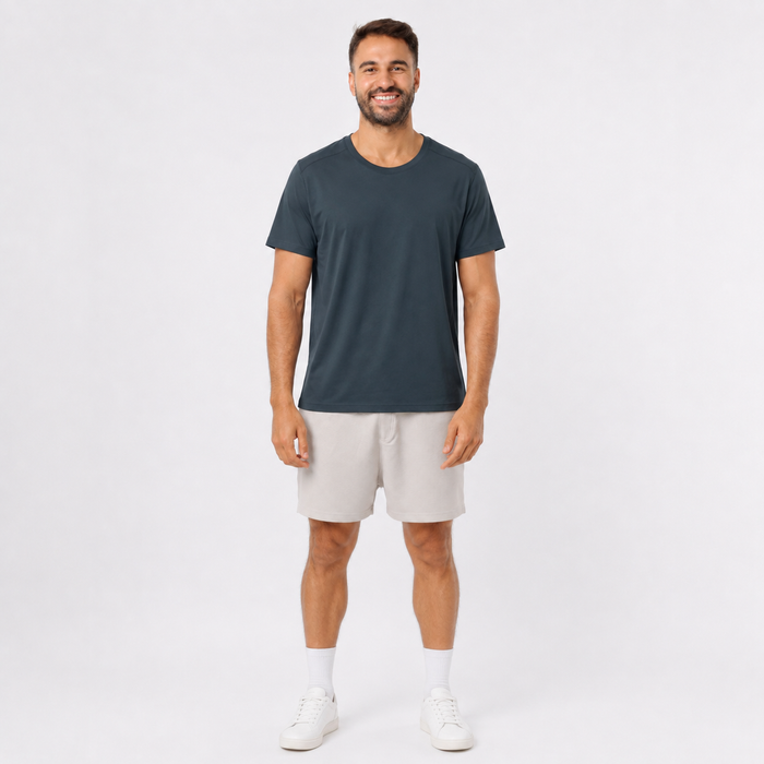 Man wearing a DARKGRAY plain polyester short-sleeve T-shirt, front view