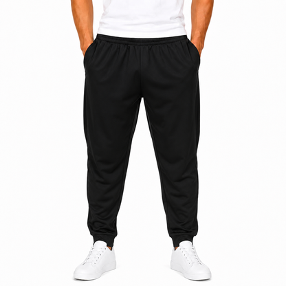 Men's black polyester jogger pants on model with elastic waist and cuffed hems