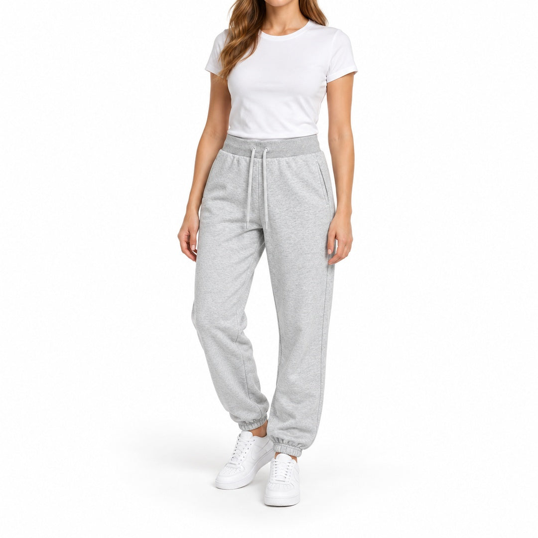 Women's light grey fleece joggers on model — style 26252105