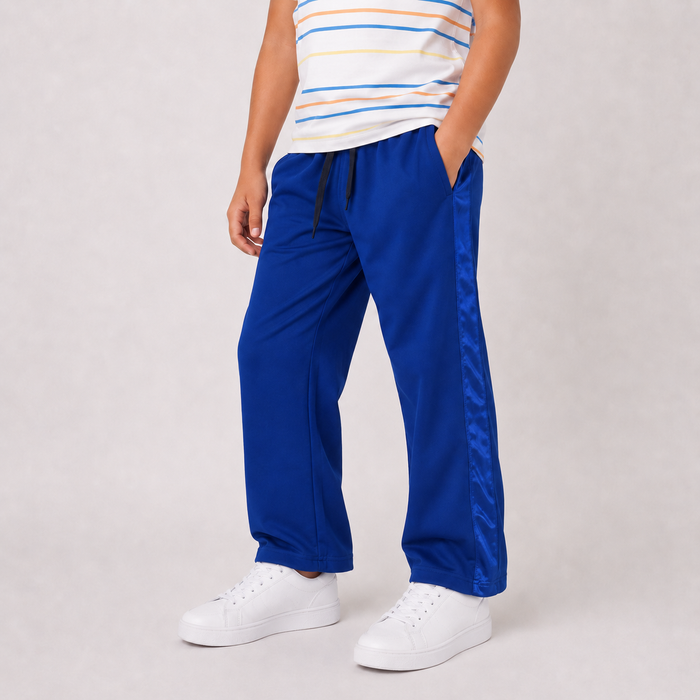 Boy wearing BLUE wide-leg drawstring pants, angled view