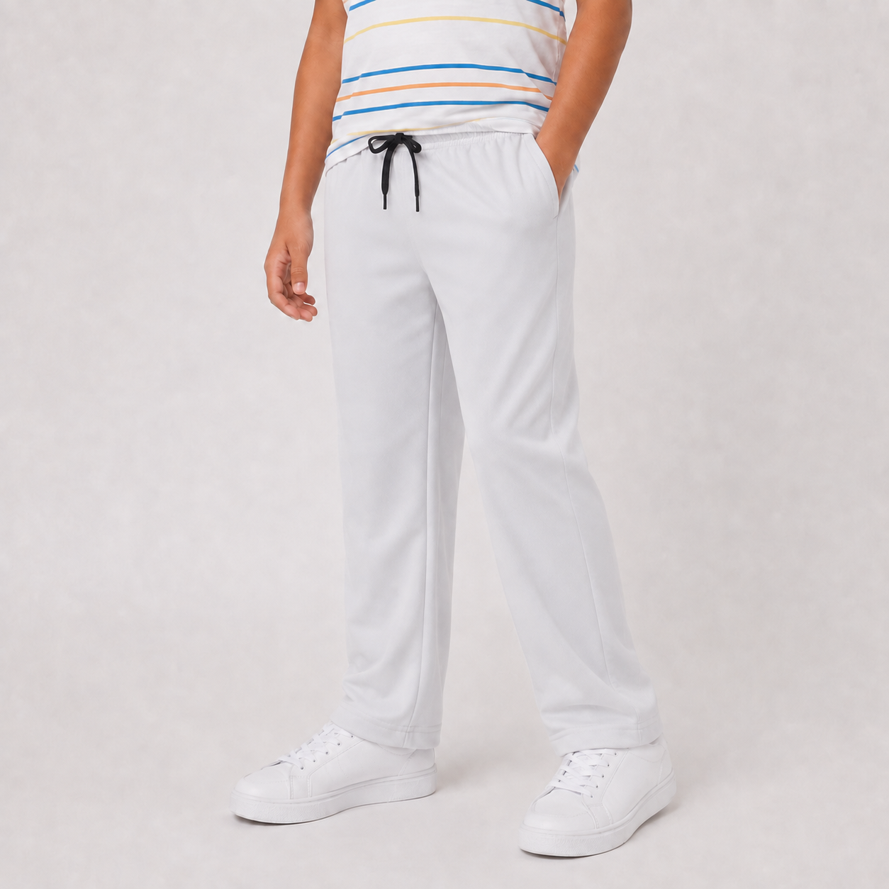 Boy wearing SILVER wide-leg drawstring pants, angled view