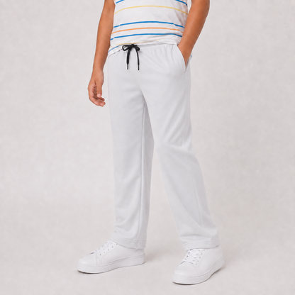 Boy wearing SILVER wide-leg drawstring pants, angled view