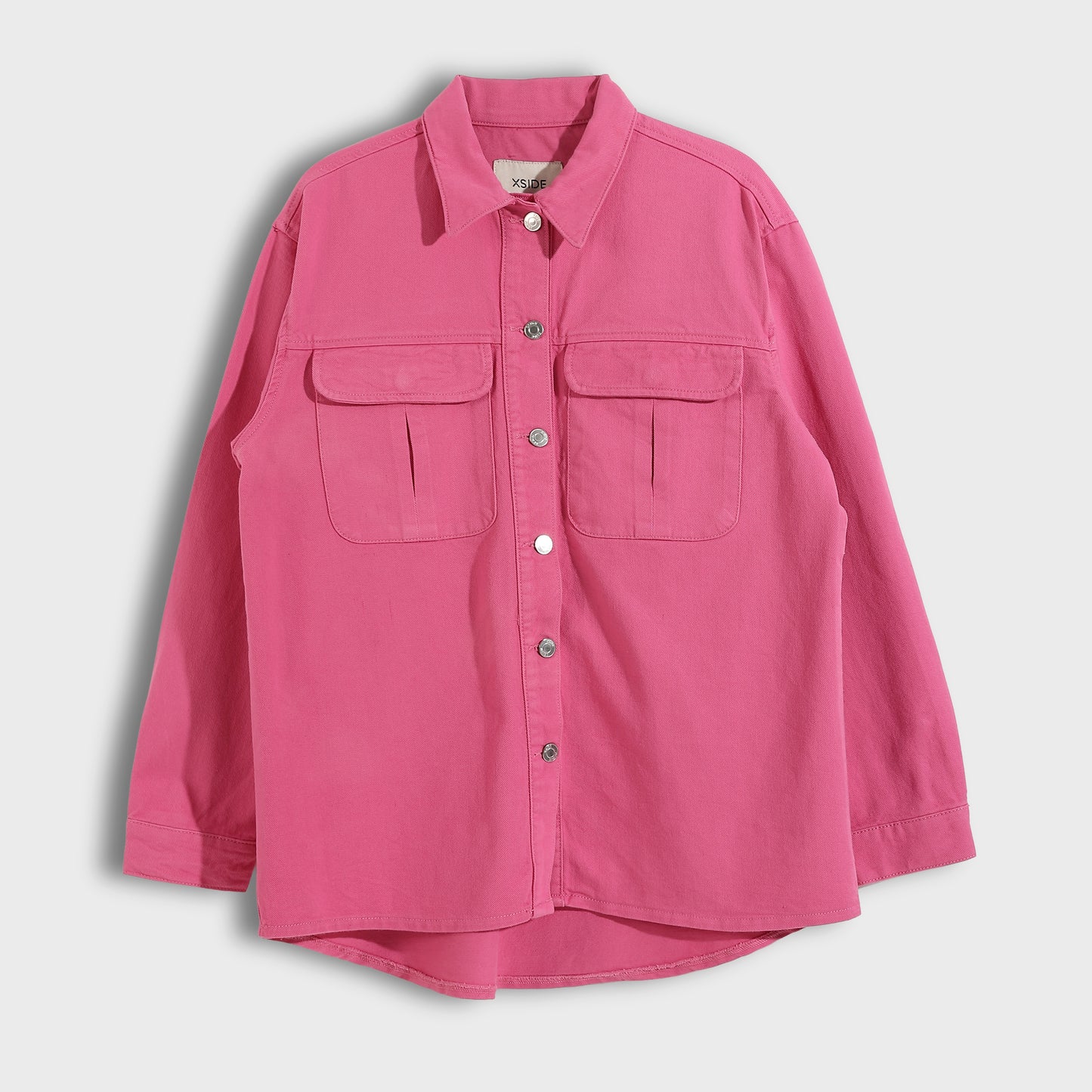 Pink button-up shirt with two front pockets on a light gray background