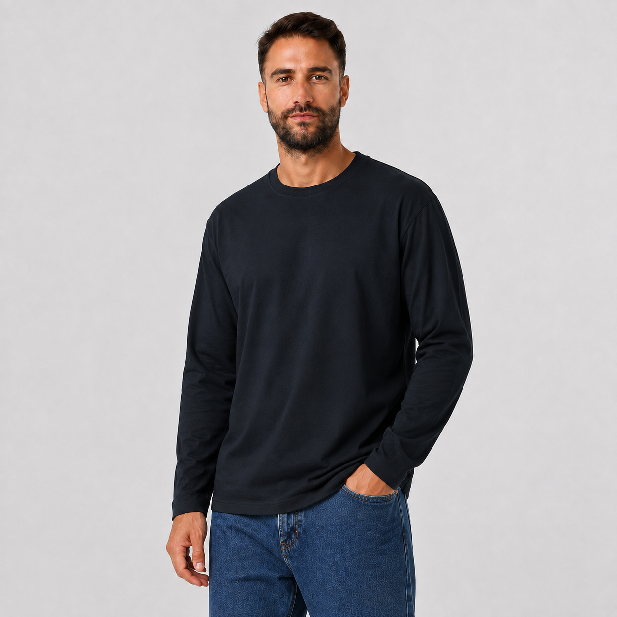 Man wearing a BLACK plain long-sleeve crew-neck T-shirt, angled view