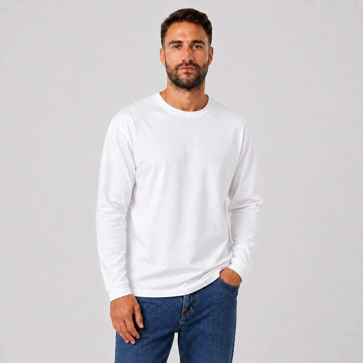 Man wearing a WHITE plain long-sleeve crew-neck T-shirt, angled view