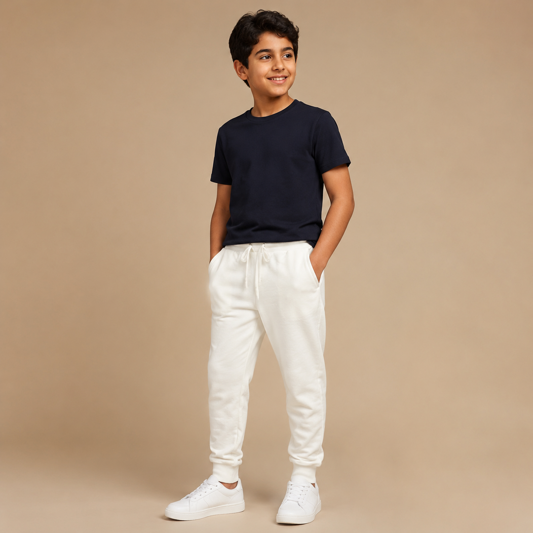 Boys cream jogger pants on model