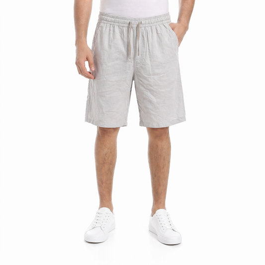 Men wearing relaxed fit linen shorts with elastic waistband and drawstring