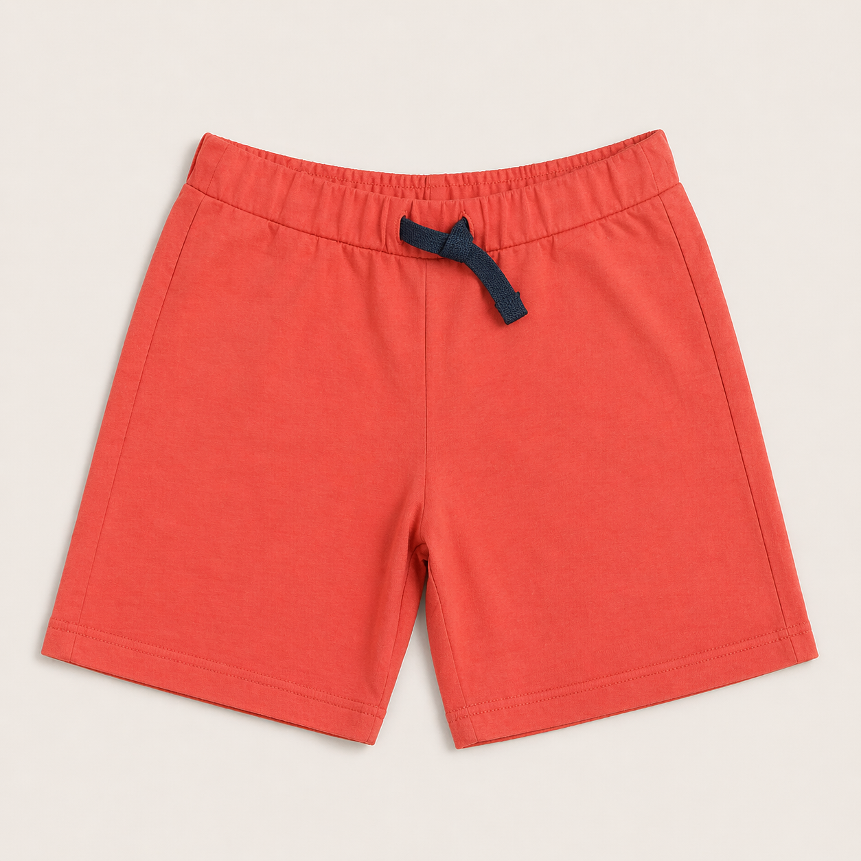 Boys wearing cotton printed shorts with elastic waistband and drawstring