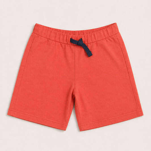 Boys wearing cotton printed shorts with elastic waistband and drawstring