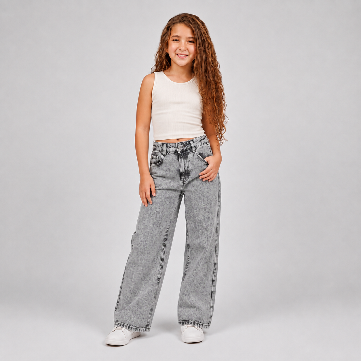 Girls wearing grey acid wash wide leg jeans with white top