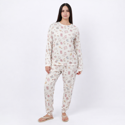 Woman wearing a patterned pajama set on a white background