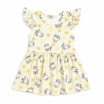 A pale yellow baby dress with a cow and sun print, featuring ruffled cap sleeves and a gathered skirt, shown flat on a white background.