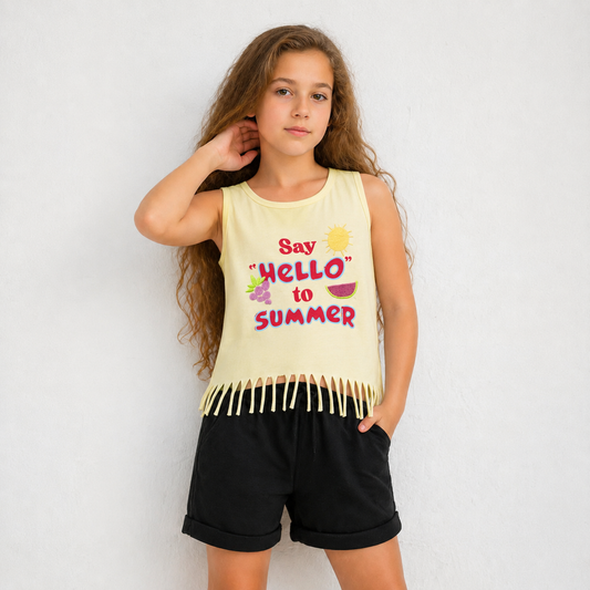 Young girl wearing a 'Say Hello to Summer' tank top with fringe details on a plain background
