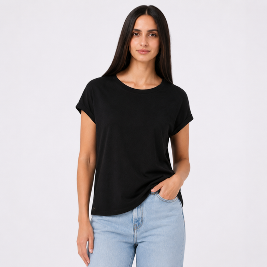 Woman wearing a black t-shirt and light blue jeans on a white background