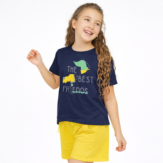 Young girl wearing a navy blue t-shirt with a graphic and yellow shorts on a white background