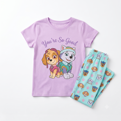 Children's pajama set with a purple shirt and blue pants featuring cartoon characters on a white background.
