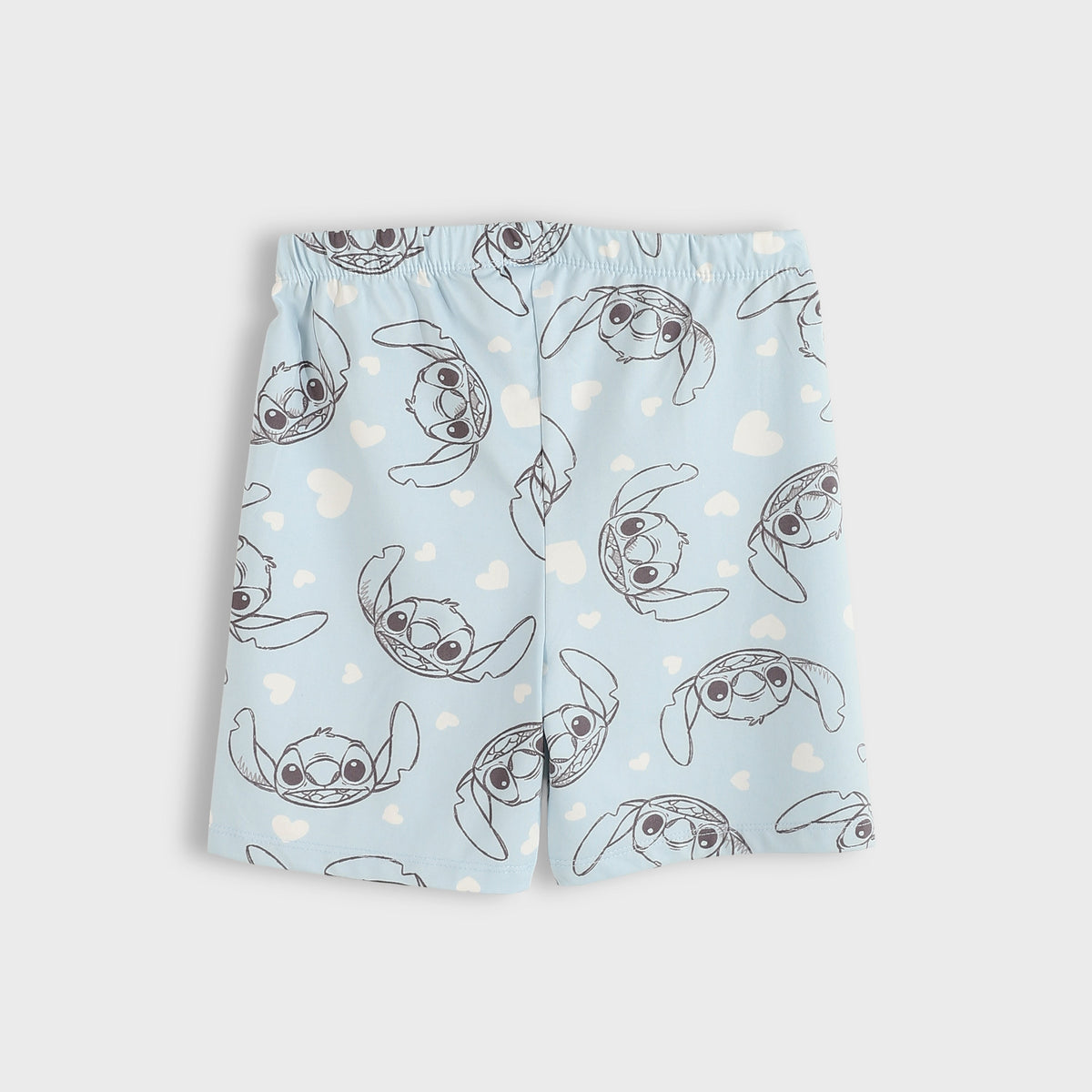 Pair of shorts with cartoon character pattern on a light blue background