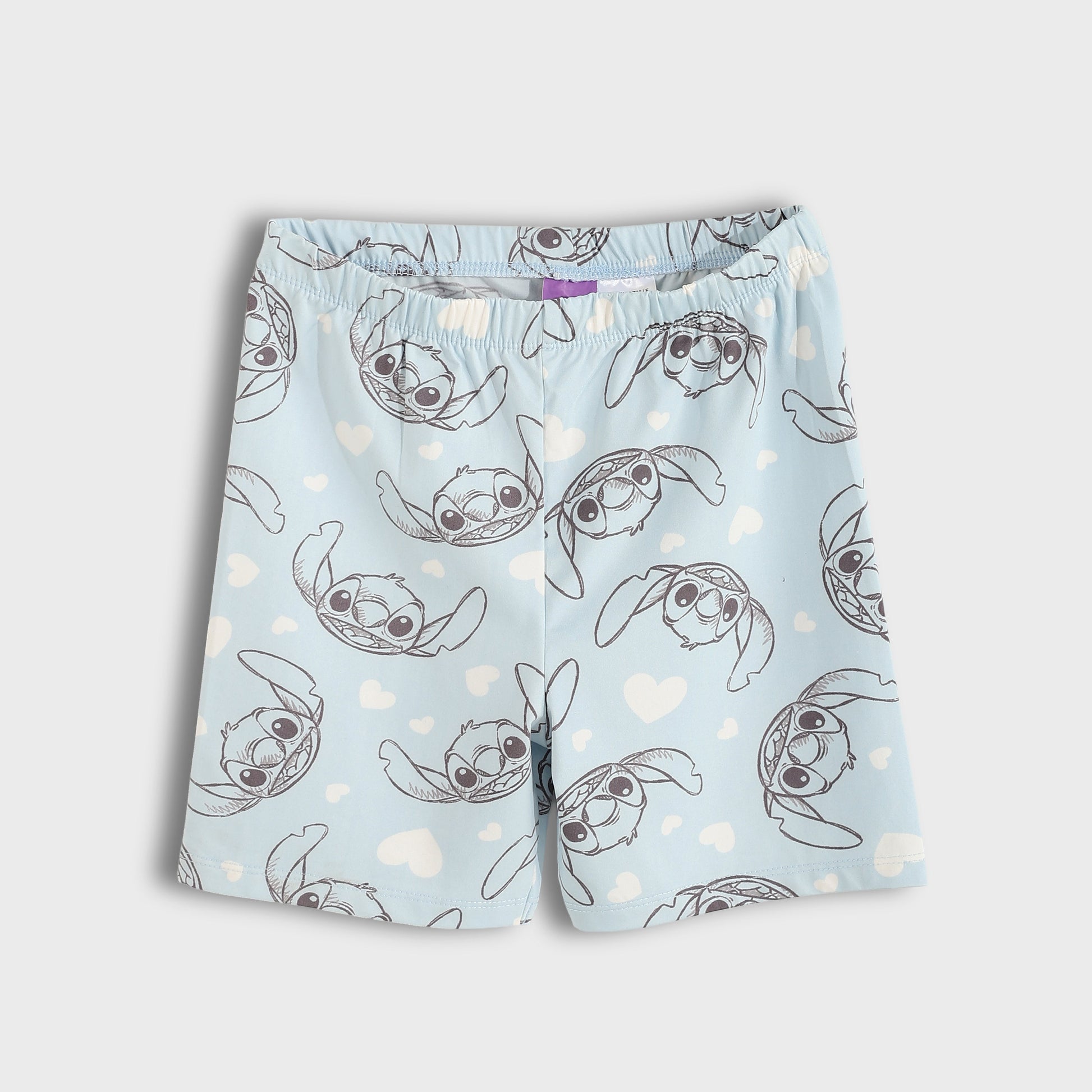 Shorts with a cartoon character pattern on a light blue background