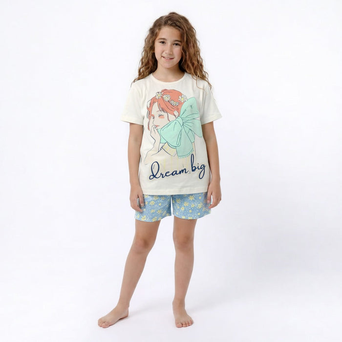 Young girl wearing a pajama set with a design and text on a white background