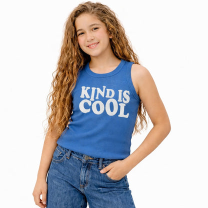 Young girl wearing a blue tank top with 'KIND IS COOL' text on a white background