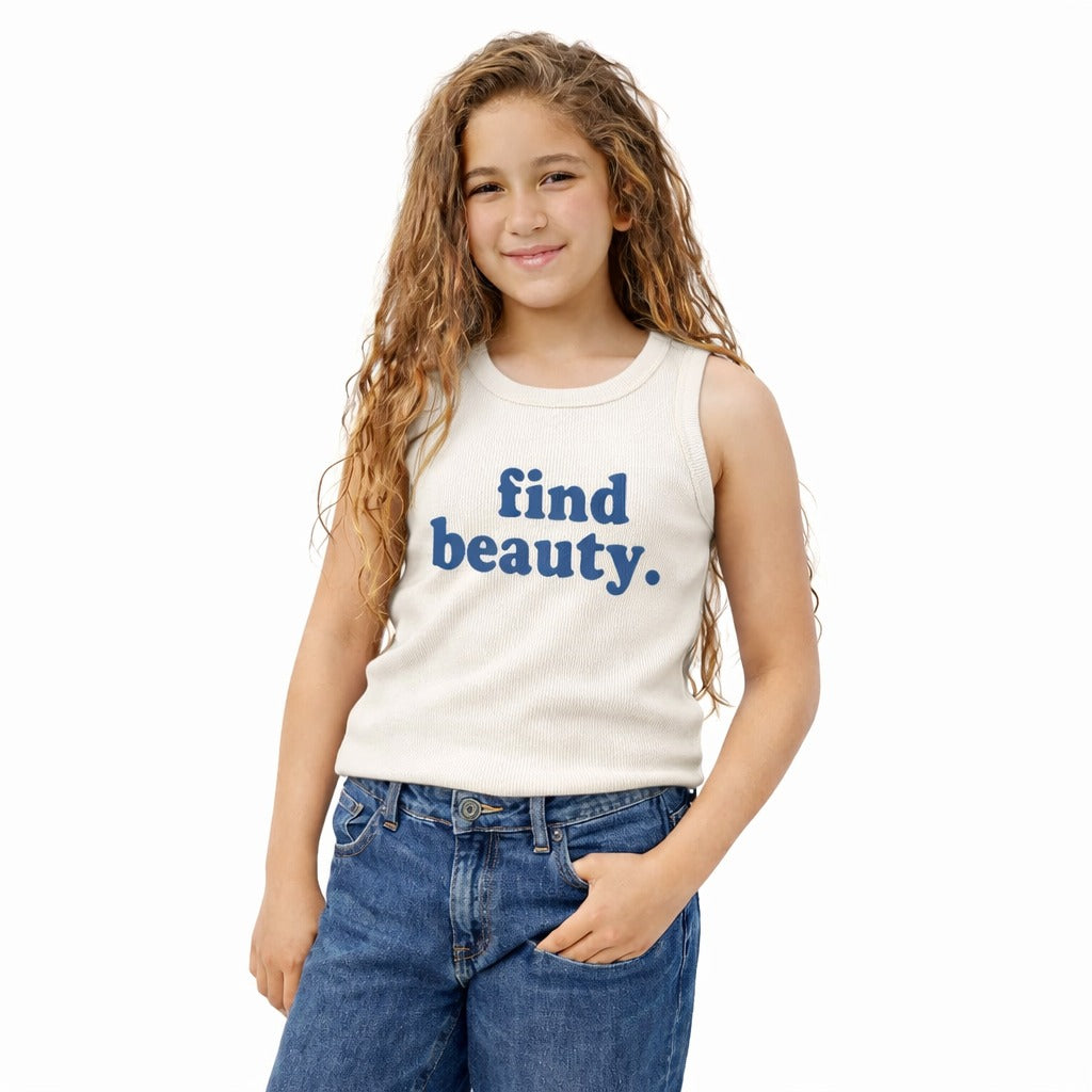 Young girl wearing a sleeveless shirt with 'find beauty.' text on a white background