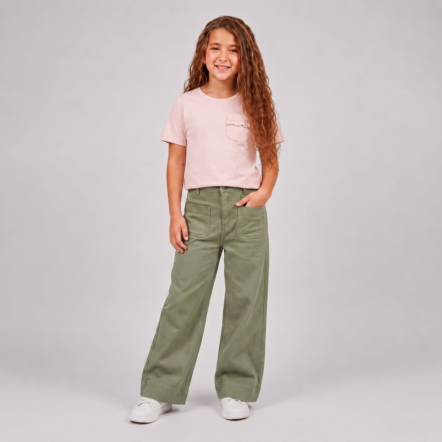 Girl wearing light green wide leg cargo pants with front patch pockets