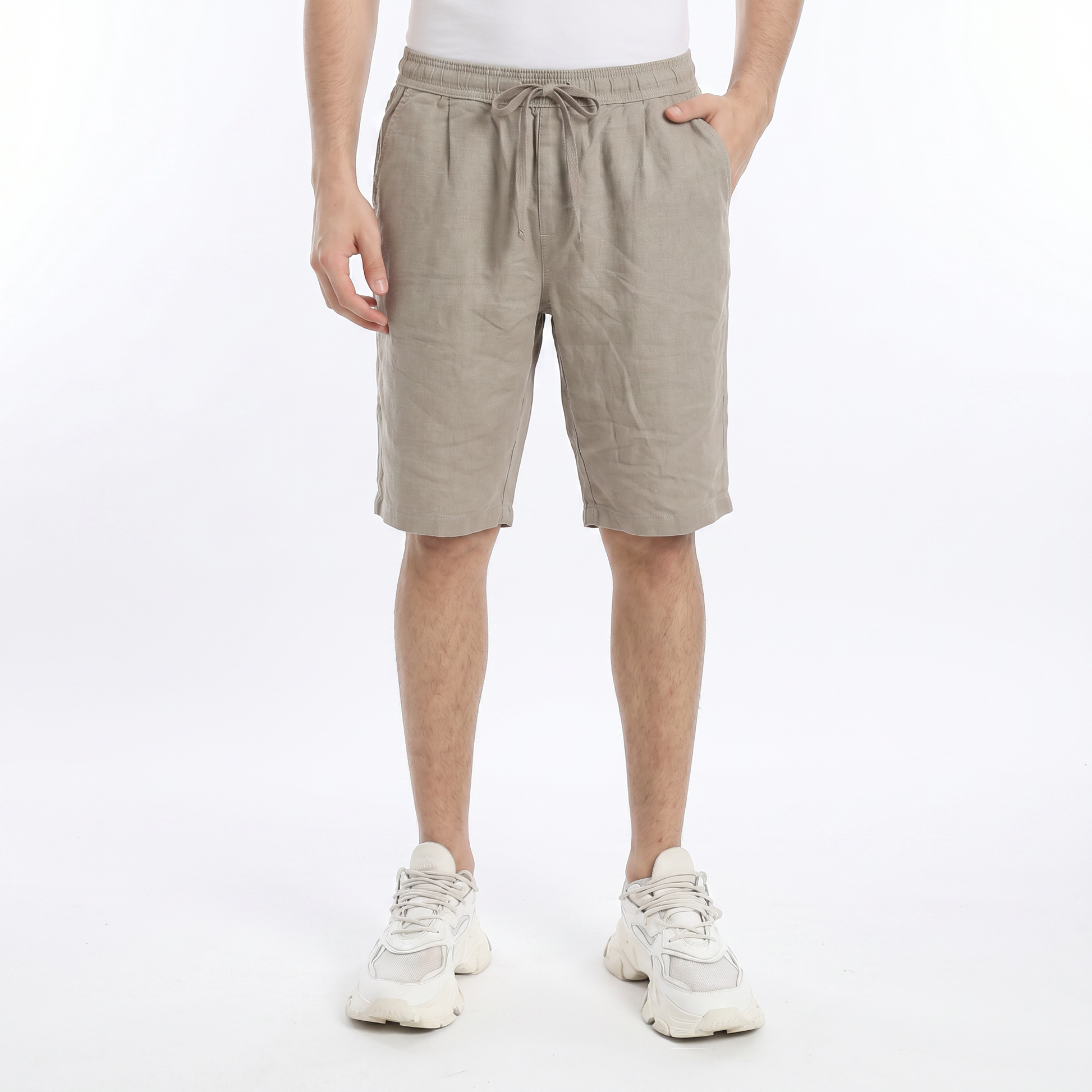 Men wearing relaxed fit linen shorts with elastic waistband and drawstring